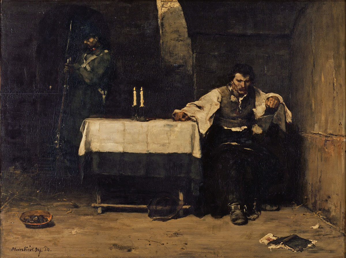 An oil painting of a man sitting alone at a small table with a tablecloth and pair of candles in a dark cell