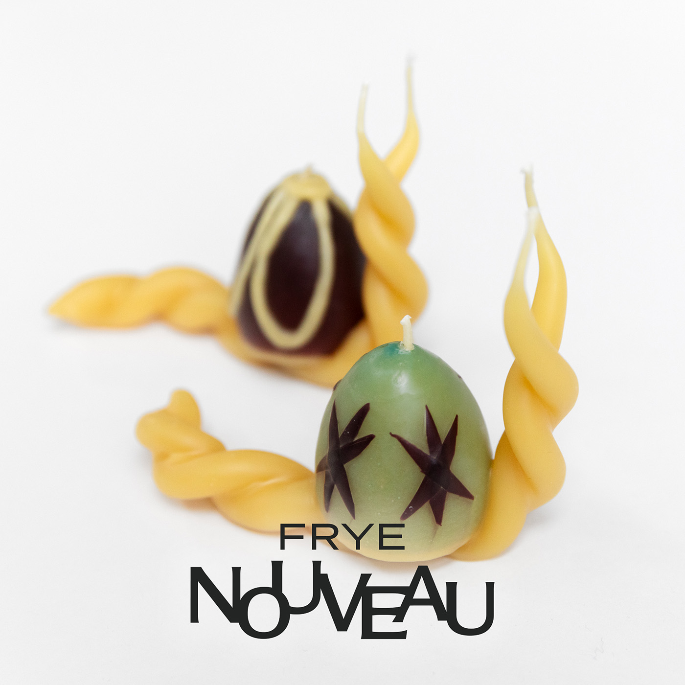 A pair of wax candles in the shape of snails with the words 'Frye Nouveau' overlaid
