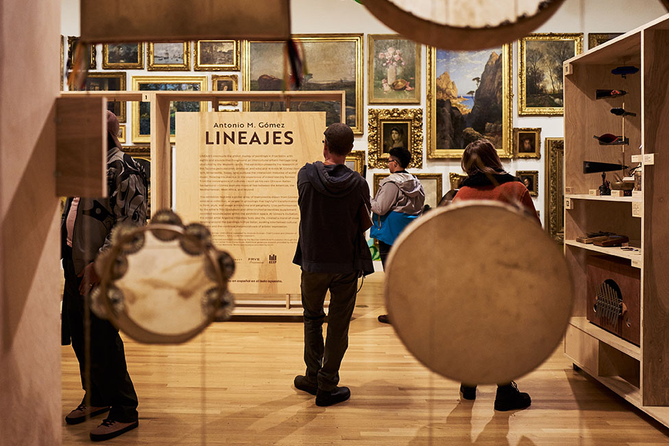 People standing in the LINEAJES exhibition at the Frye Art Museum