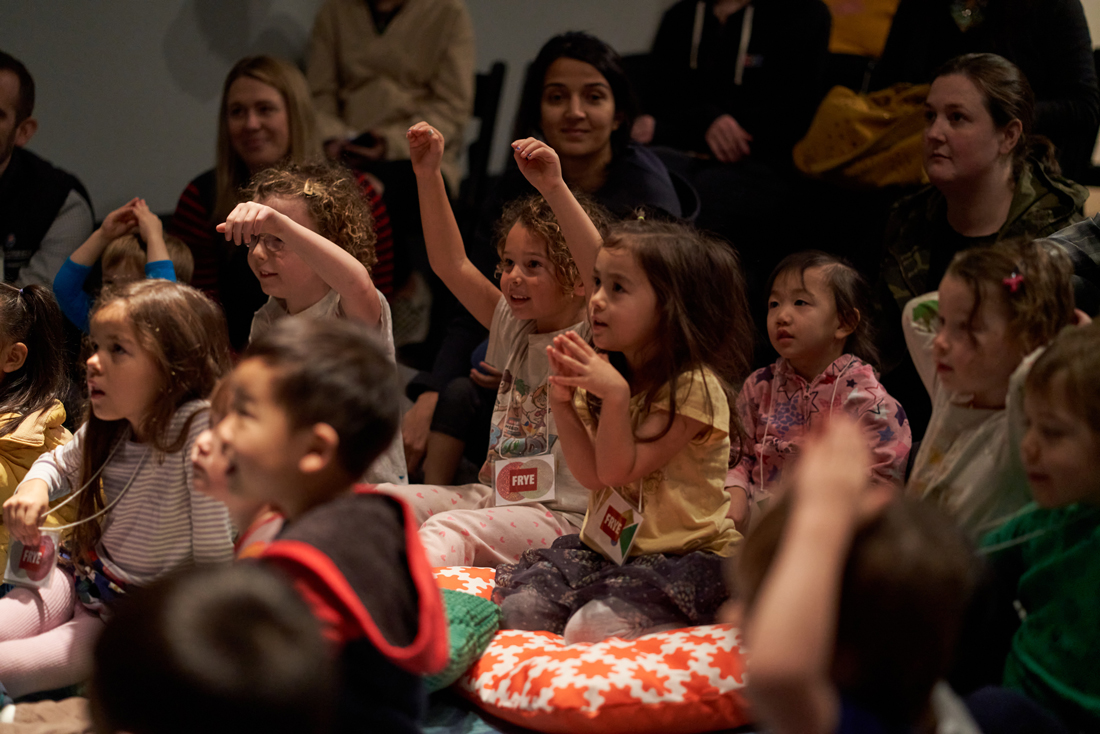 Children seated on the floor in the audience of a Small Frye program