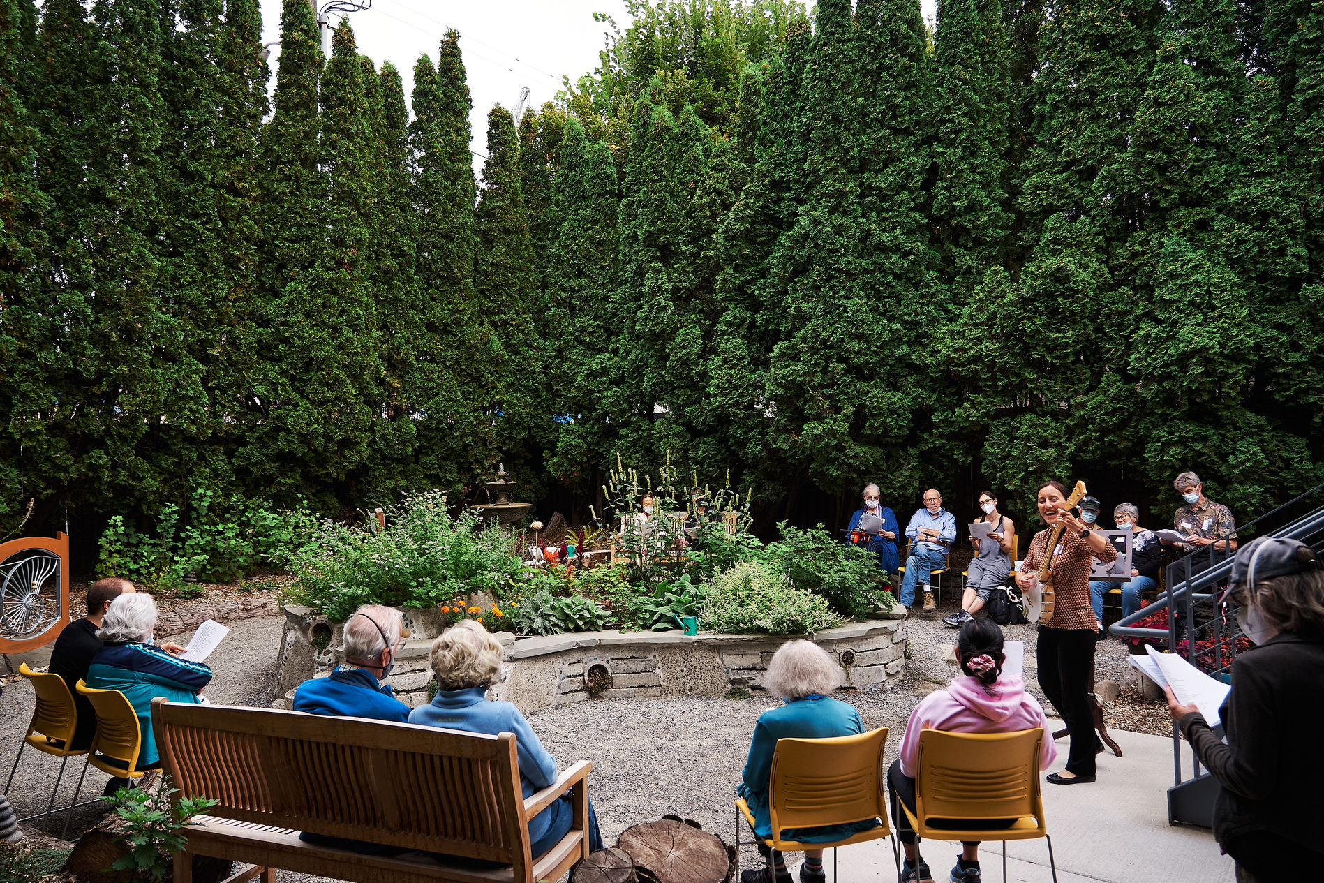 Creative aging participants enjoying music in the Memory Hub courtyard