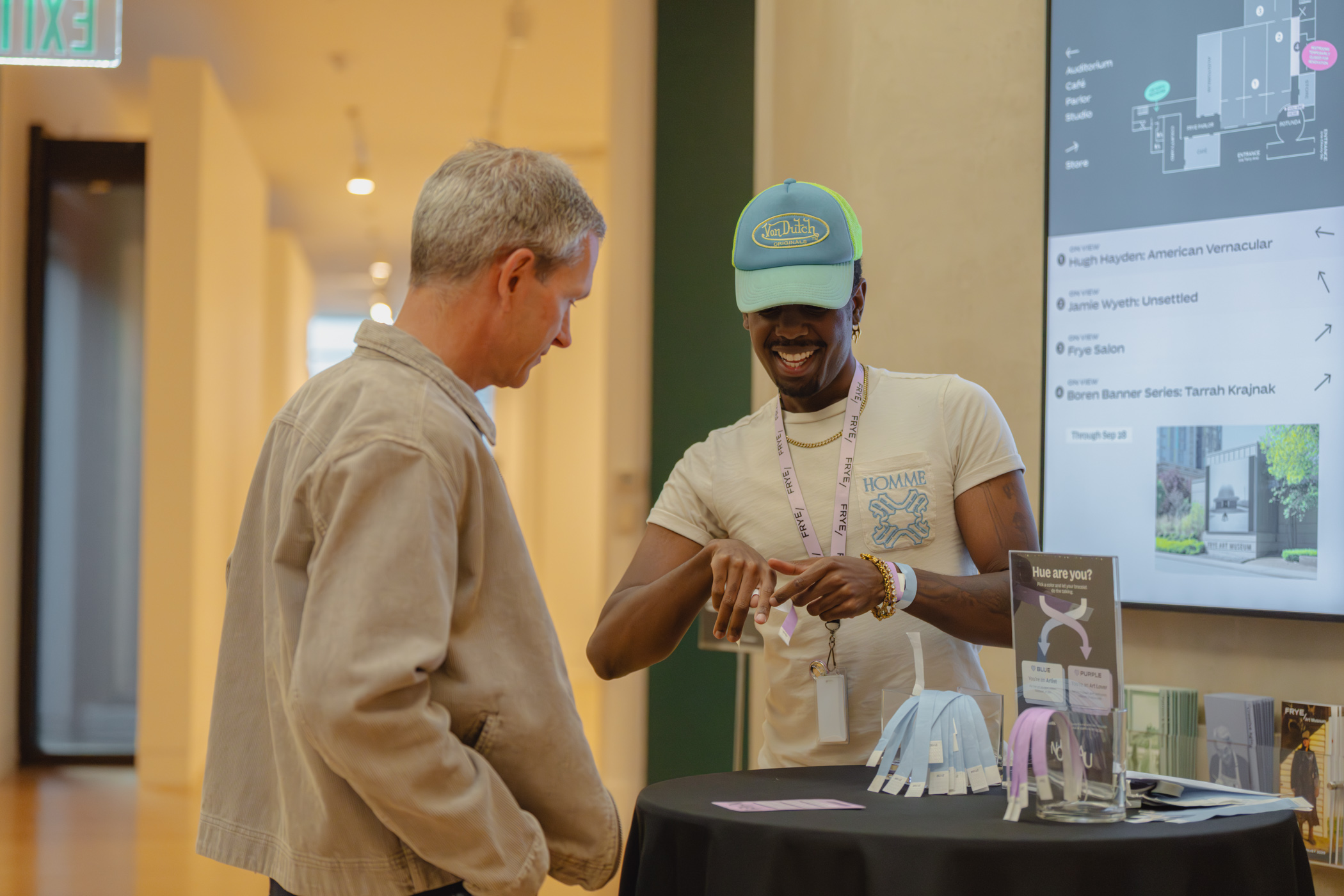 A person being handed a wristband