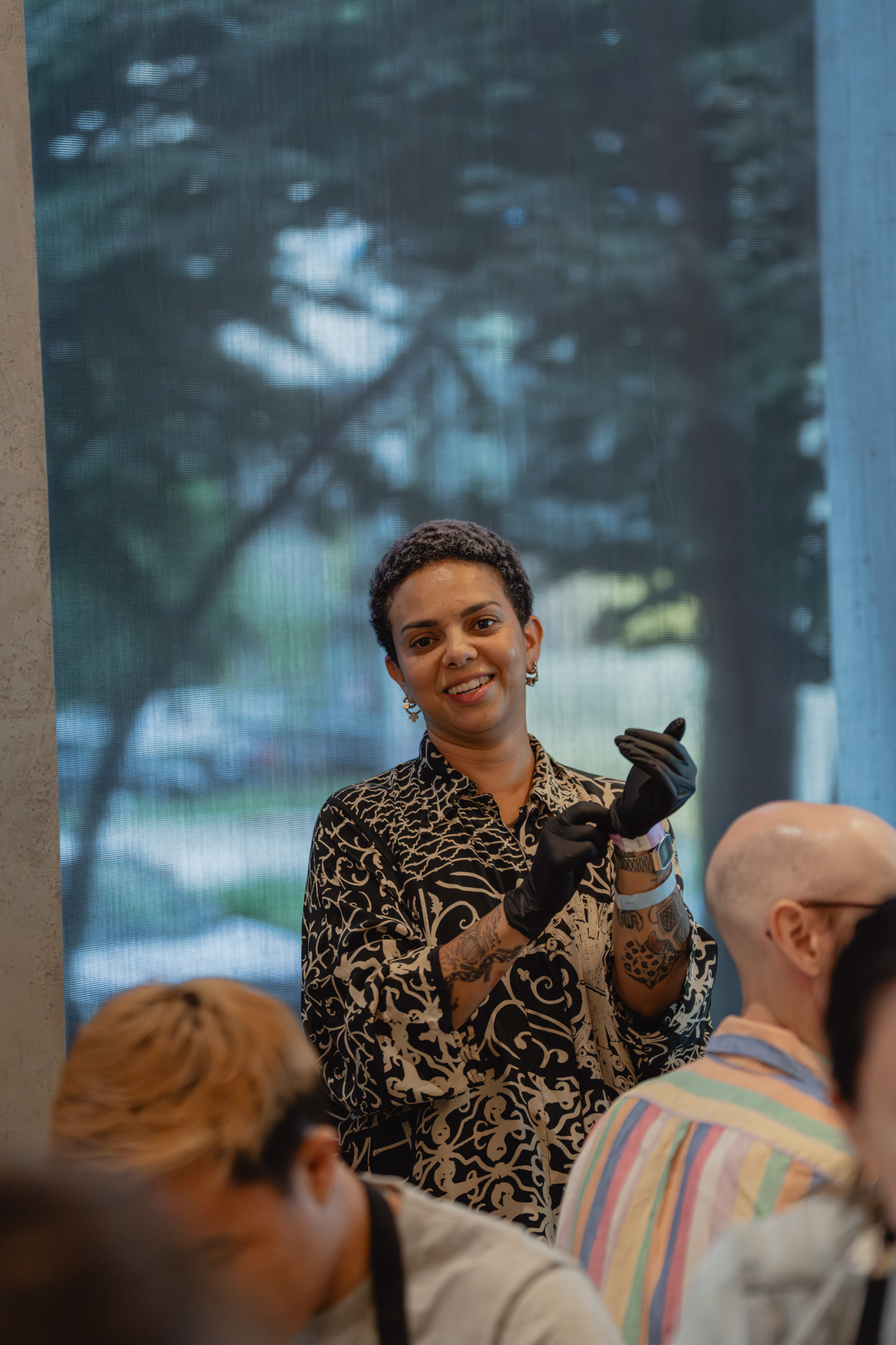 A person standing and leading an art activity