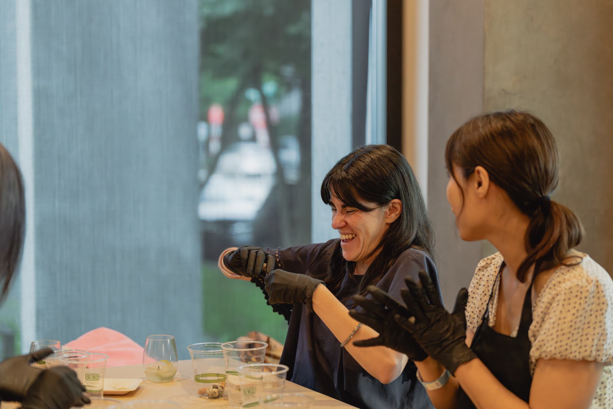 A person smiling while engaged in an art activity