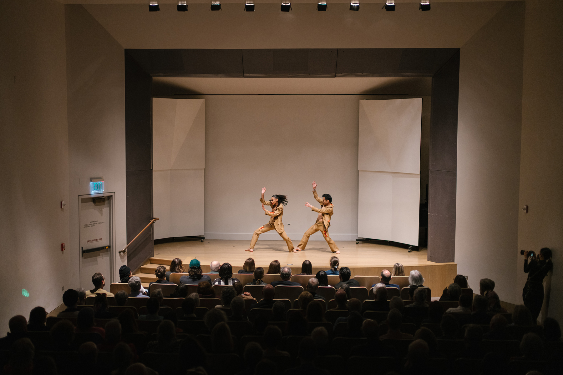 Dancers on stage in front a full audience in the Frye Auditorium