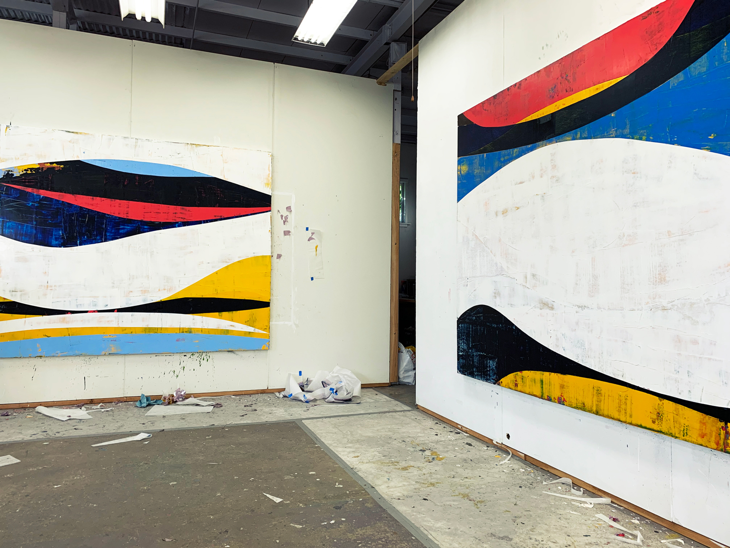 Photo of Ken Kelly's studio with two of his large paintings on the walls