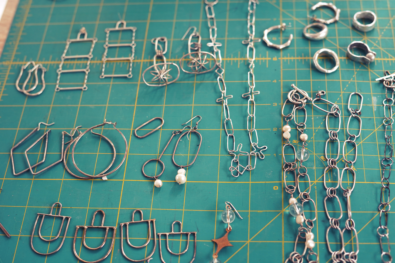 Photo of an assortment of silver jewelry pieces