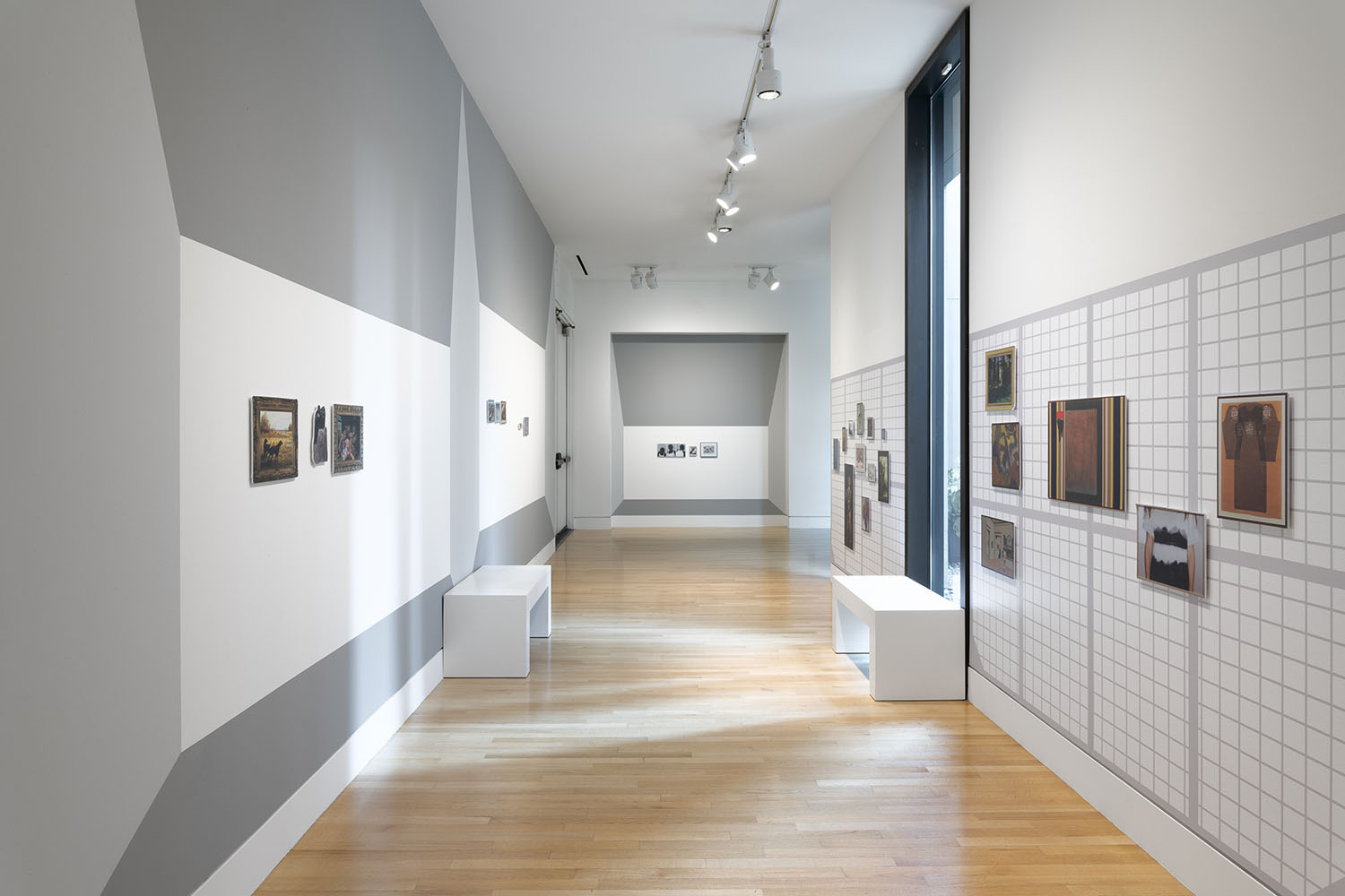 Magnetic artwork reproductions on grey and white museum gallery walls
