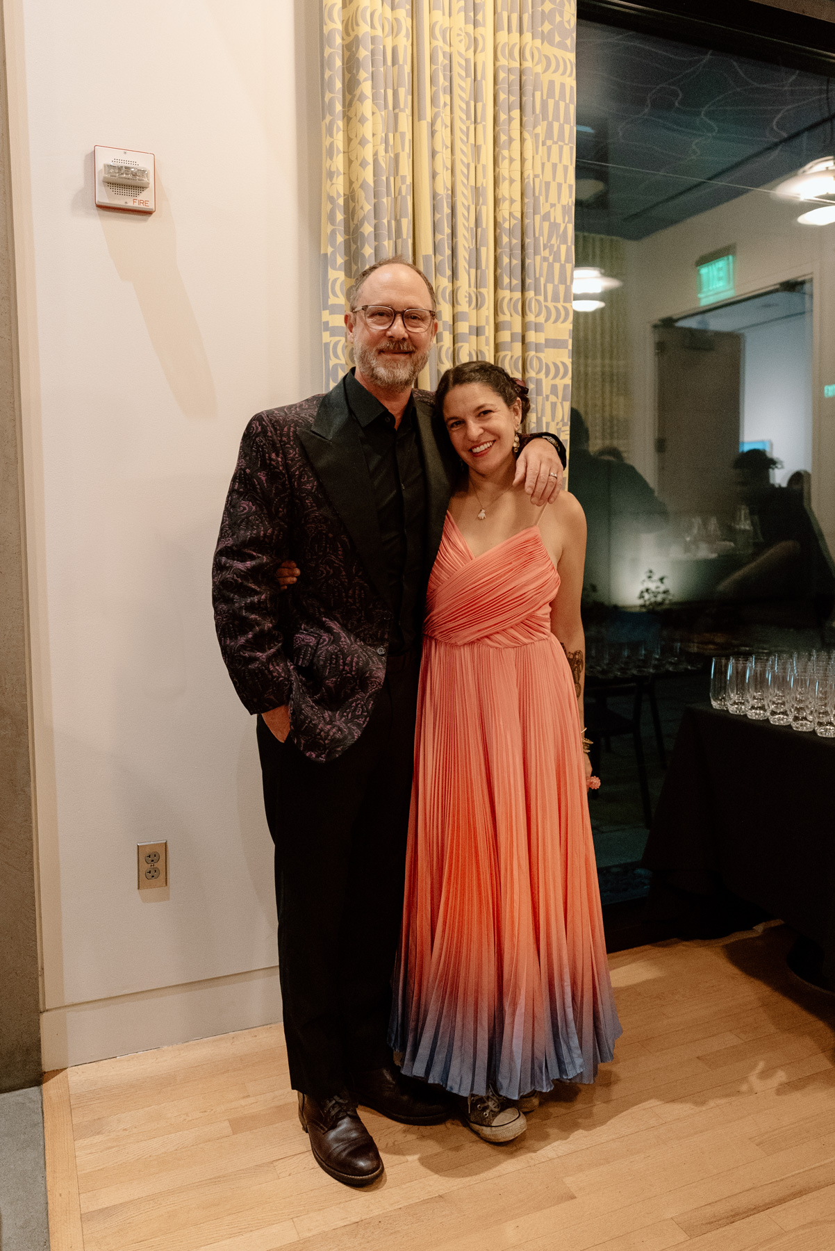 A couple standing together and smiling