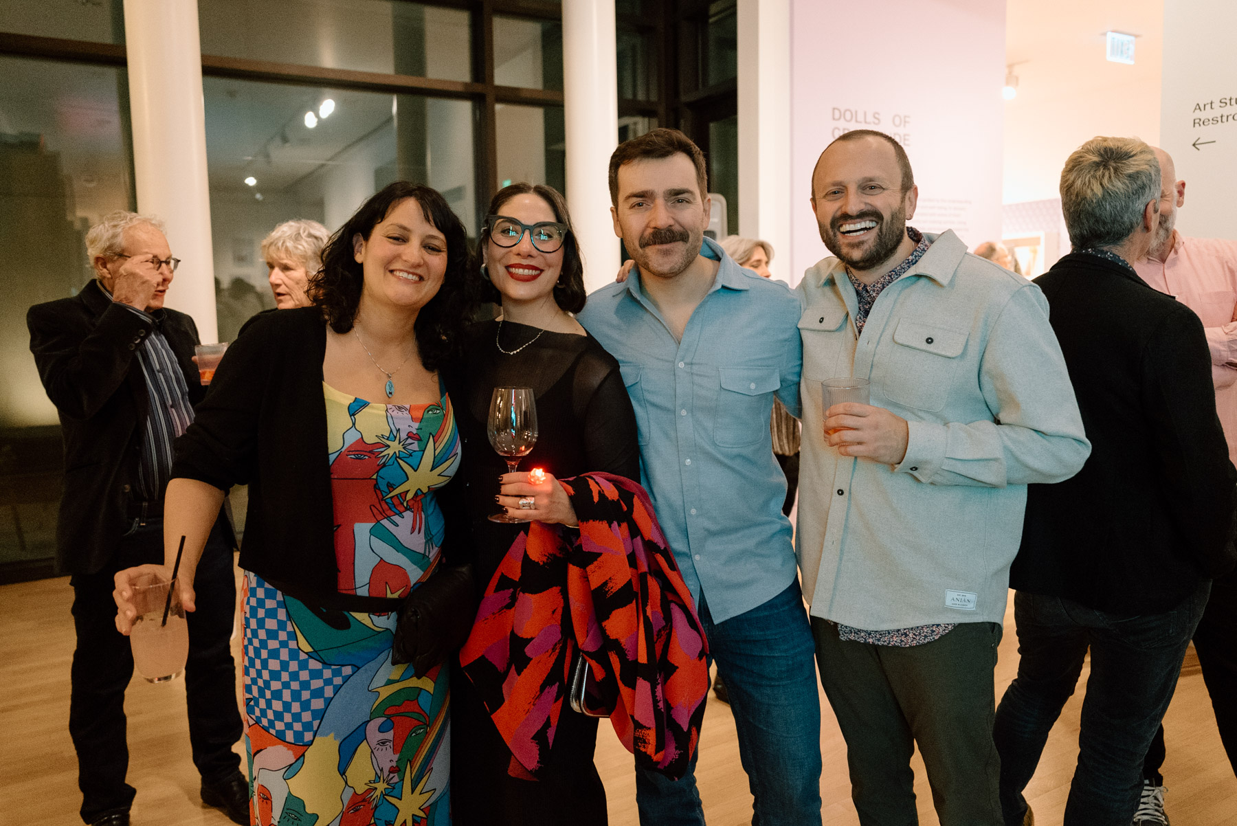 People posed in a line and smiling