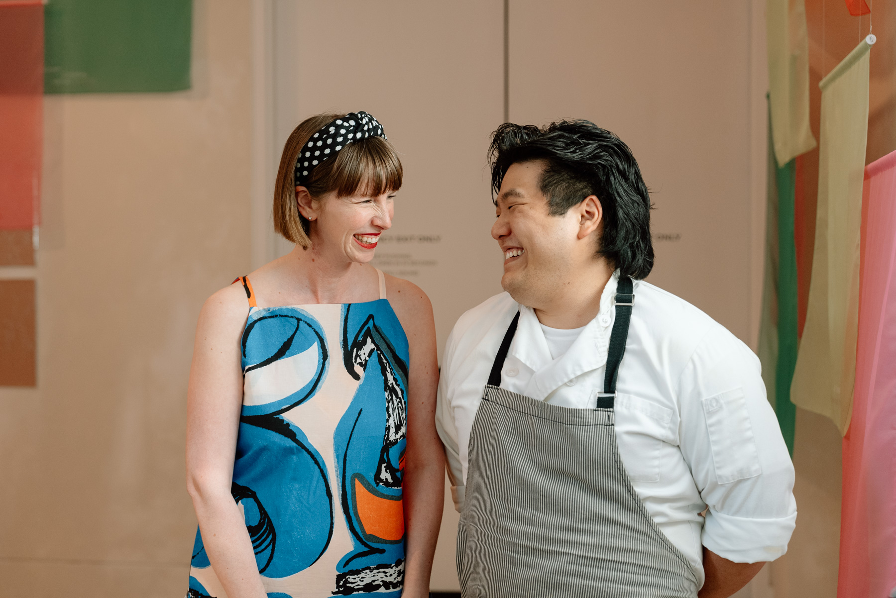 Two people looking at each other and smiling