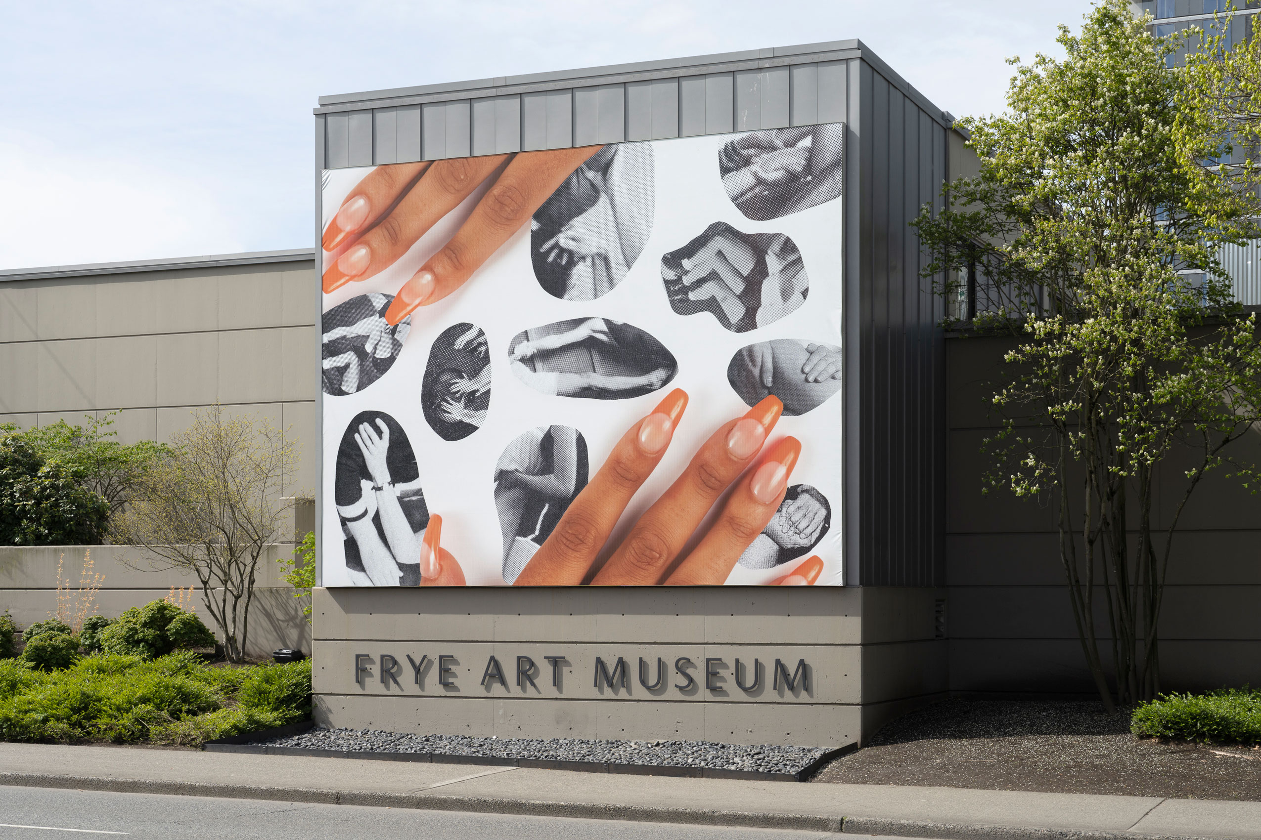 Installation view of Laura Hart Newlon's Boren Banner, two hands with orange nail polish placed over a collage of black and white photos of arms and legs