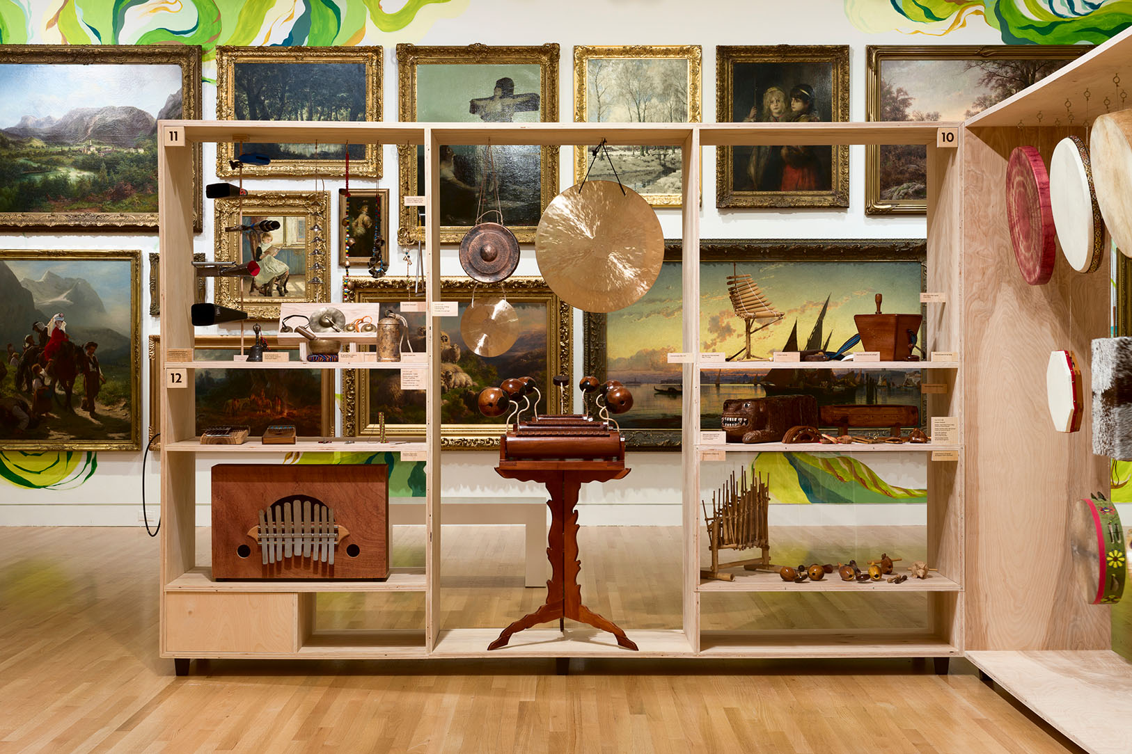 Installation view of musical instruments presented in front of the Frye Salon in Antonio M Gómez: LINEAJES at the Frye Art Museum