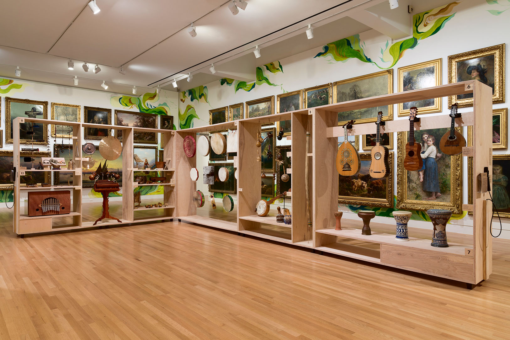 Installation view of musical instruments presented in front of the Frye Salon in Antonio M Gómez: LINEAJES at the Frye Art Museum