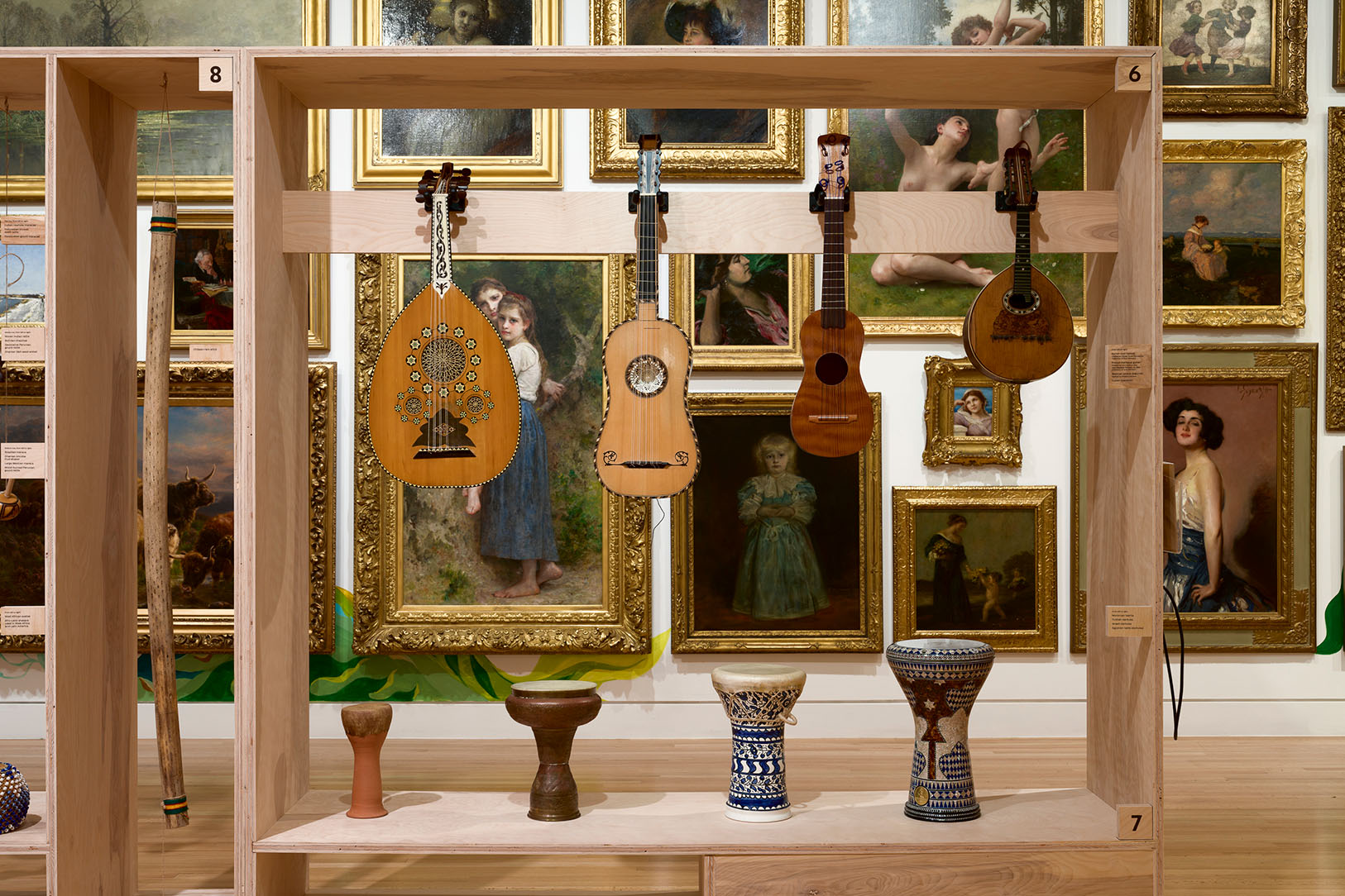Installation view of musical instruments presented in front of the Frye Salon in Antonio M Gómez: LINEAJES at the Frye Art Museum