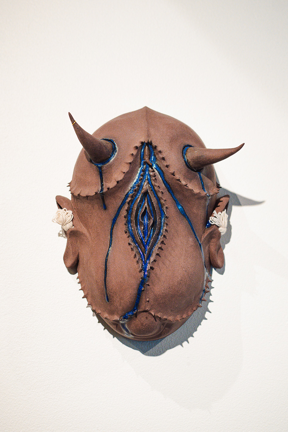 Hanako O’Leary. War Mask 5: The Healer, 2019. Red clay, glaze, cotton. 13 x 8 x 6 in. Courtesy of the artist and ArtX Contemporary. Photo: ArtX Contemporary