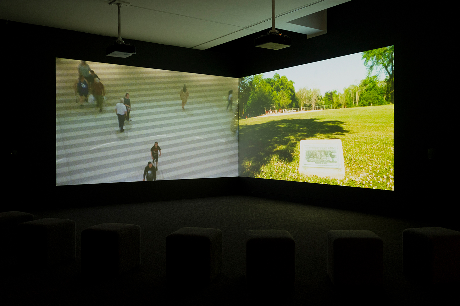 Installation view of dual-channel video artwork by Sky Hopinka in the exhibition gallery at the Frye Art Museum