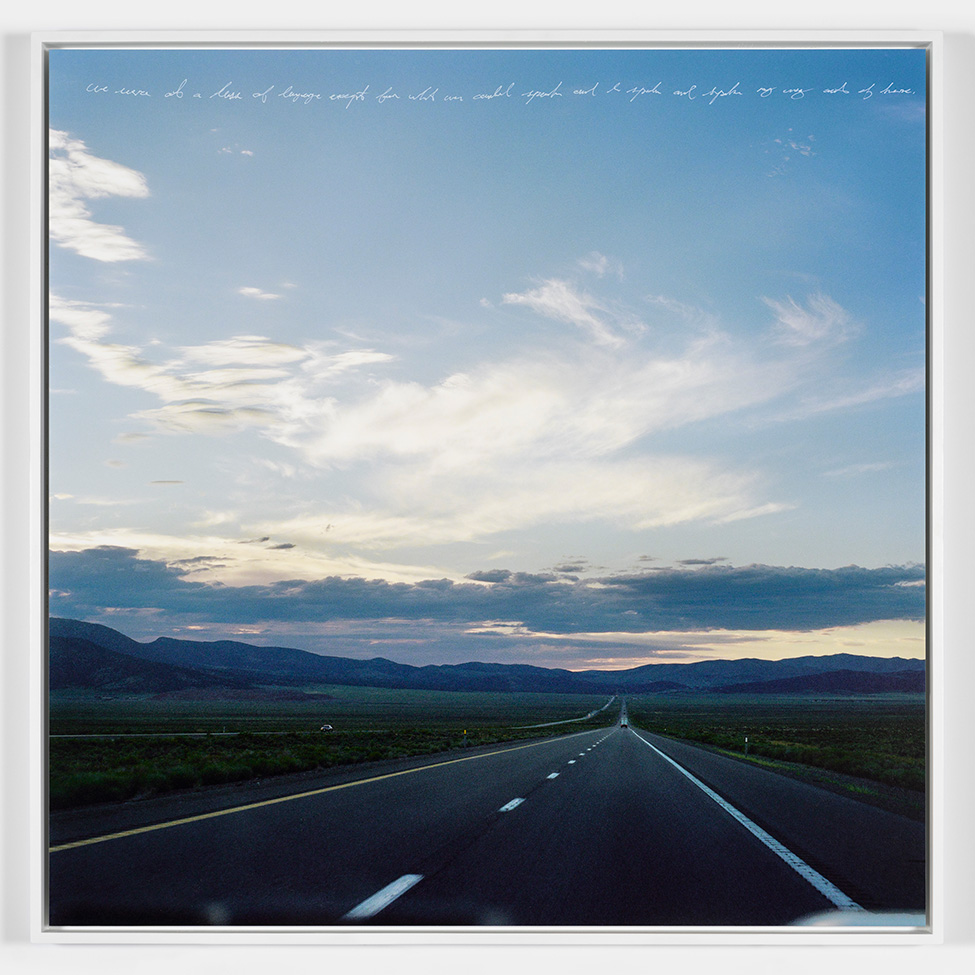 A photo of a open road and blue sky in the evening