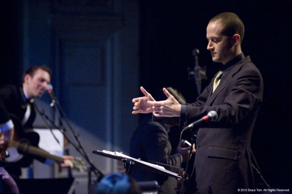 Joshua conducting for Jherek Bischoff. Photo by Bruce Tom