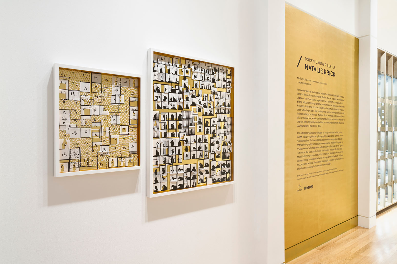 Collage artwork hanging on a wall next to a large, gold painted section of wall with exhibition text written on it