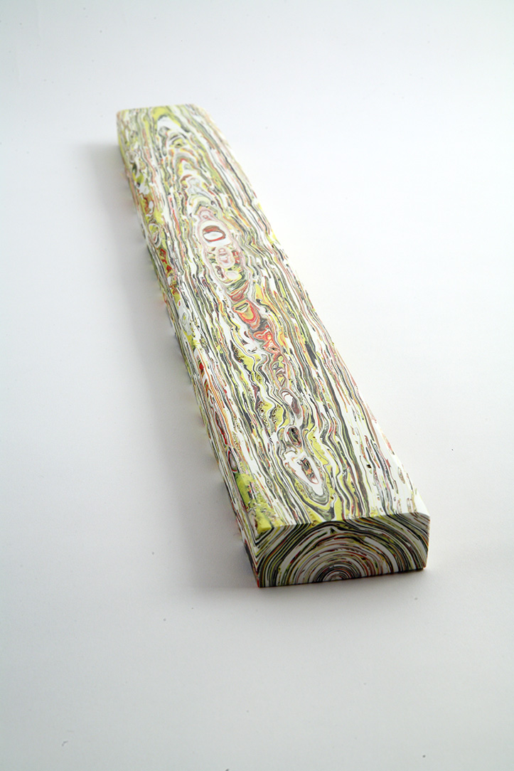 An acrylic artwork in the shape of a 2x4 piece of wood by Margie Livingston