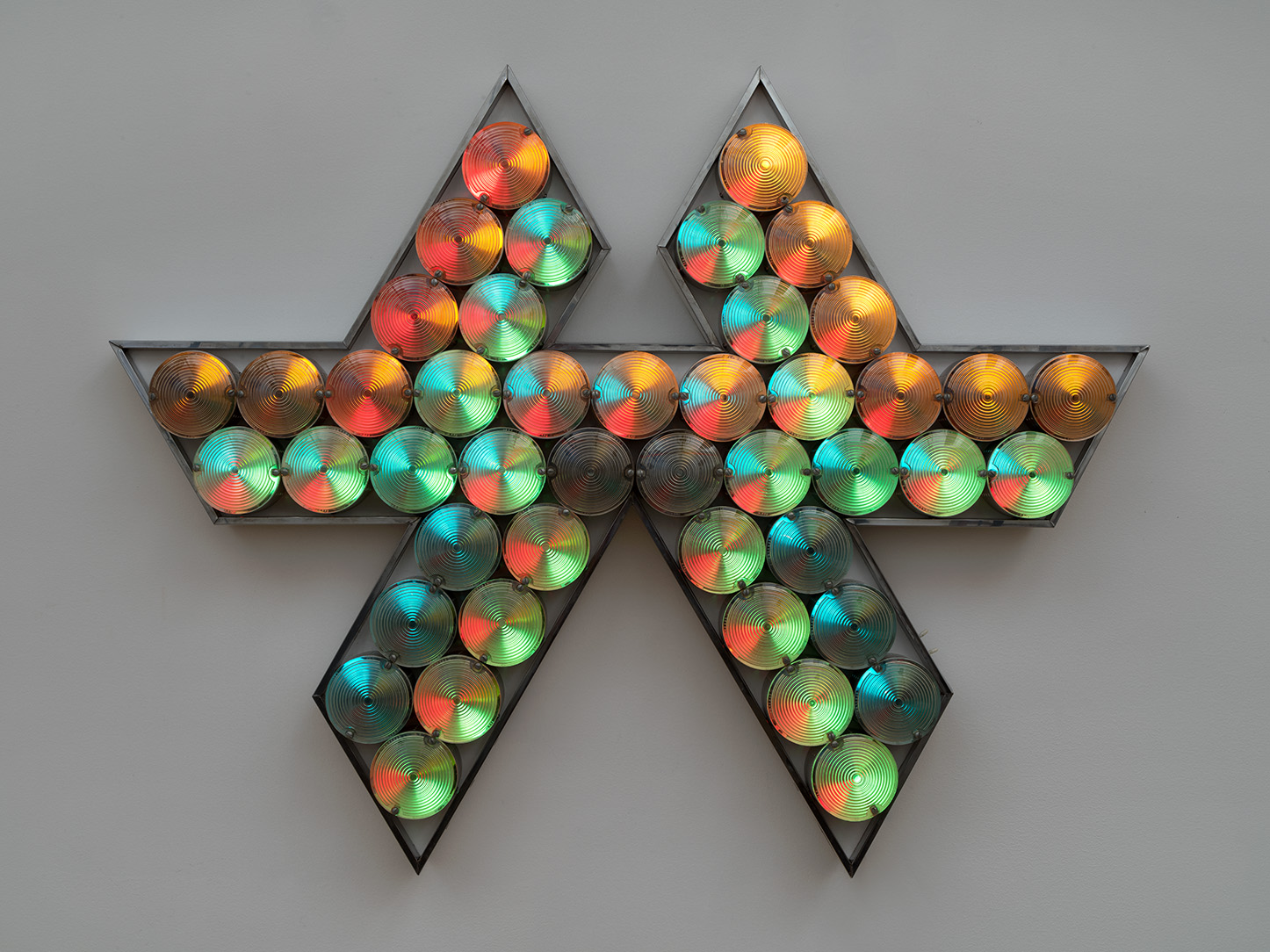 An artwork made up of colorful lightbulbs in a frame