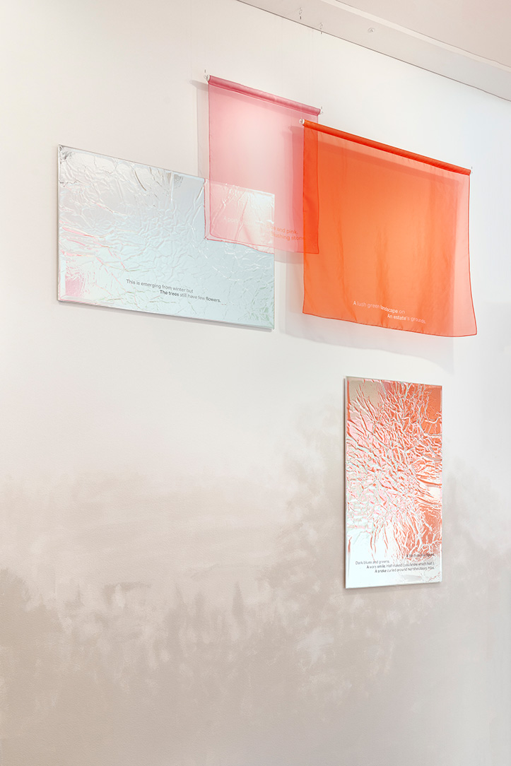 A set of colored fabrics and reflective panels on a wall with lightly painted shadows