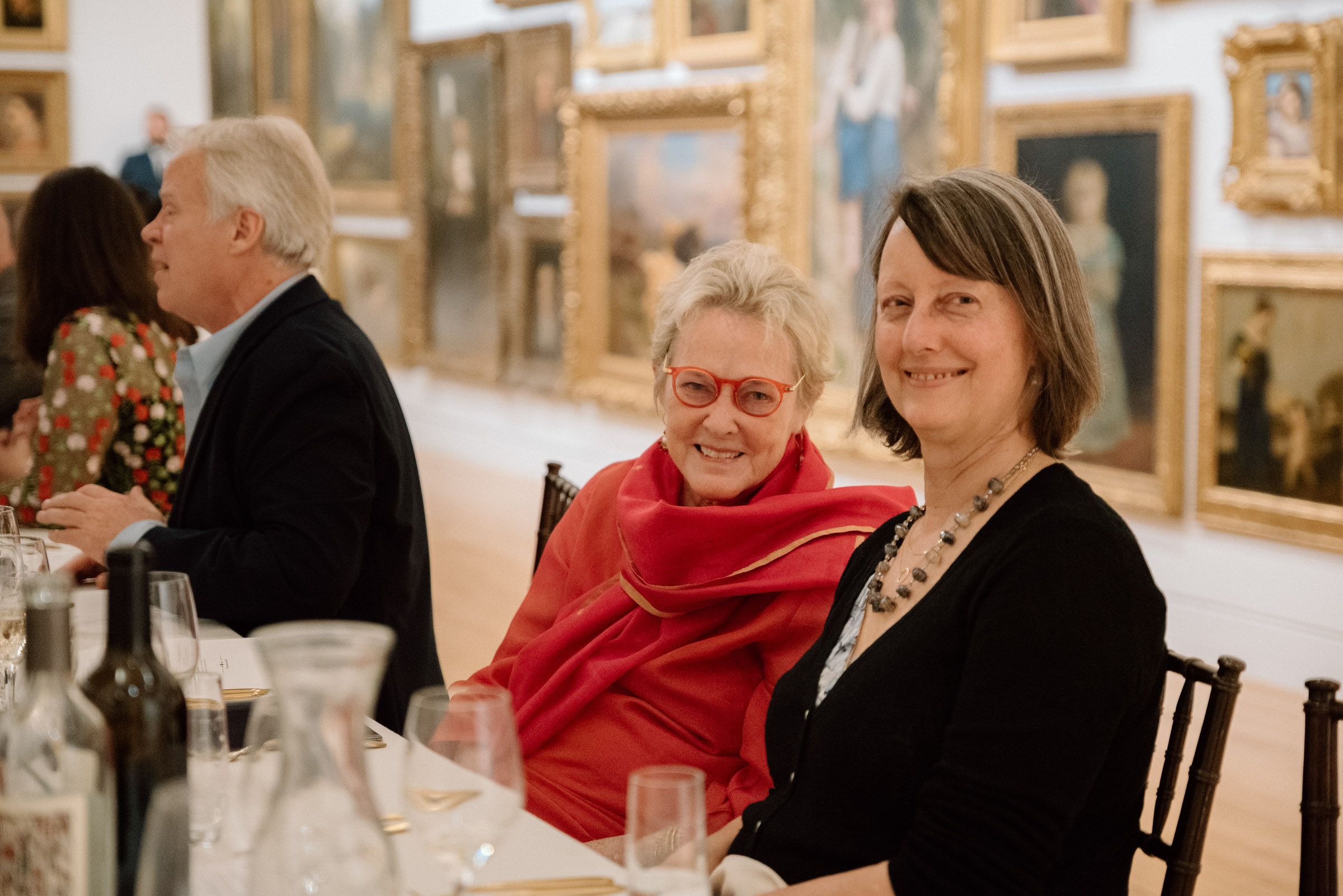 People sitting at a table and smiling