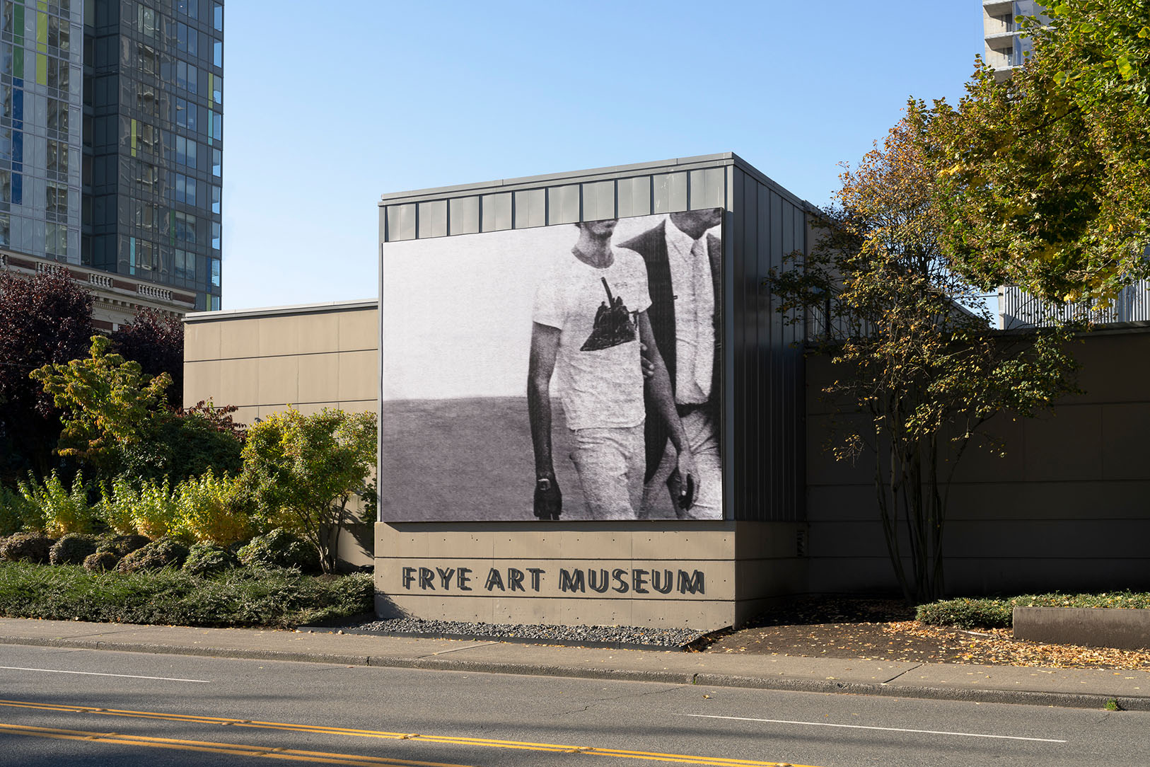 A photo of Rafael Soldi's Boren Banner installed on the side of the Frye Art Museum building