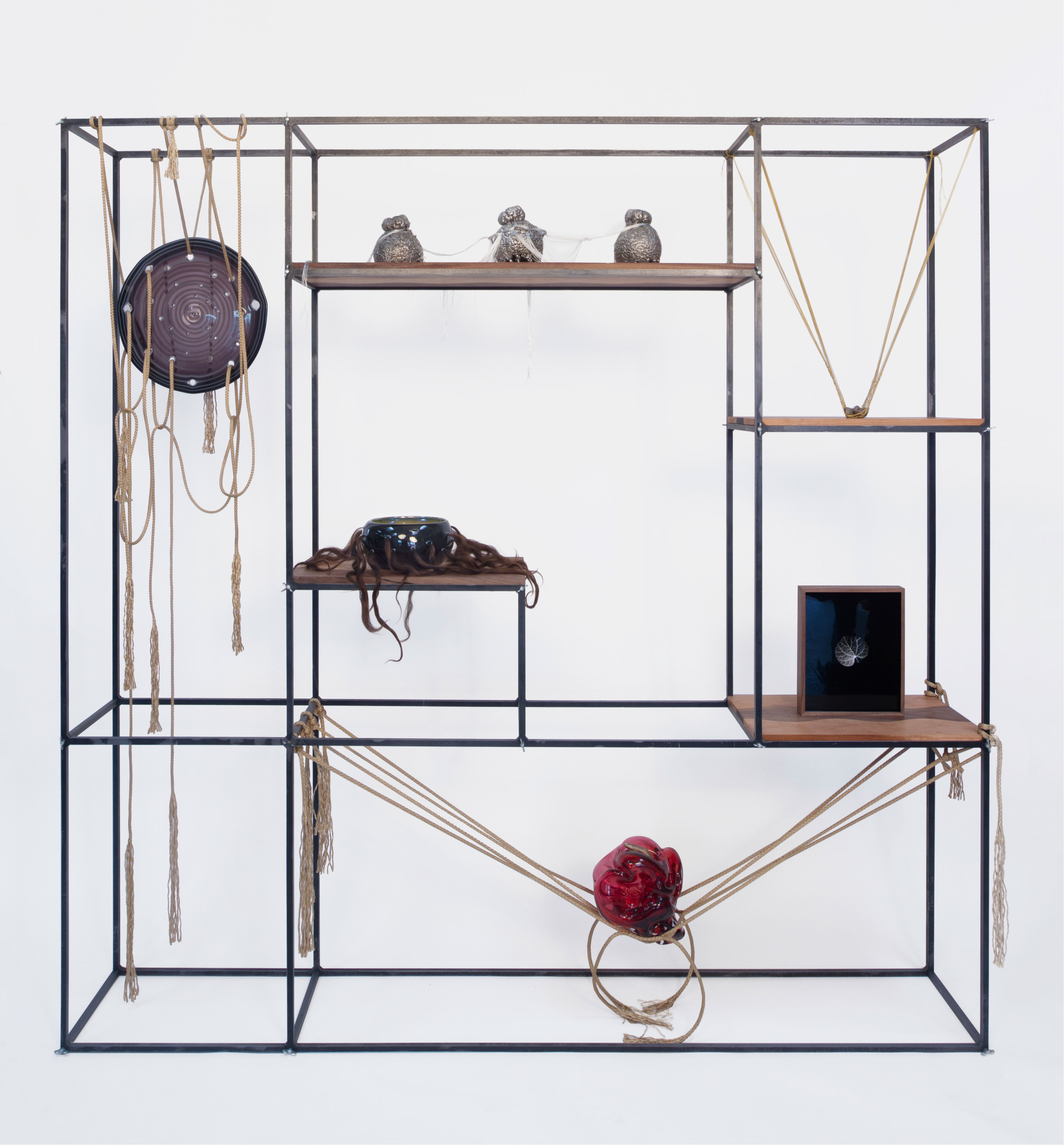 Kelly Akashi. Figure Shifter, 2018. Steel, wing screws, cherry wood, walnut wood, stainless steel, rope, blown glass, hair, ortho litho film, bronze, cotton thread, silk thread, and brass wire. 72 x 72 x 12 in. Courtesy of the artist, François Ghebaly Gallery, and Tanya Bonakdar Gallery