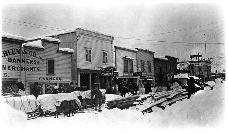 An snow-covered street in Valdez, Alaska in the early 20th century