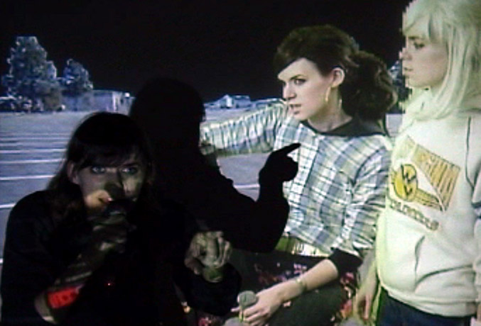 A still from a video of a band made up of three of the same person