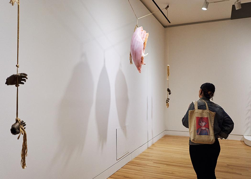 A person looking at an artwork in Kelly Akashi: Formations at the Frye