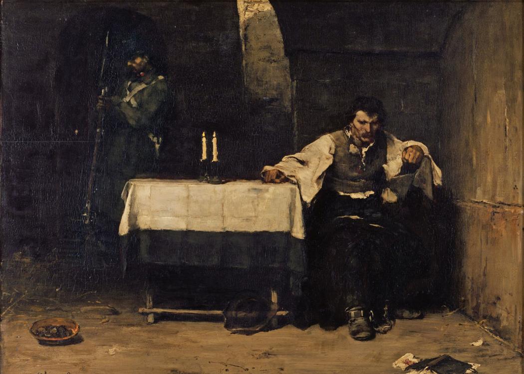 An oil painting of a man sitting alone at a small table with a tablecloth and pair of candles in a dark cell