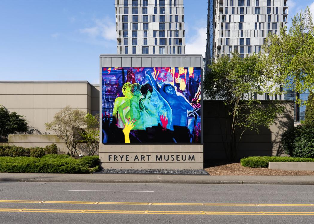 A large, colorful artwork installed on the exterior of a building above the text 'Frye Art Museum'