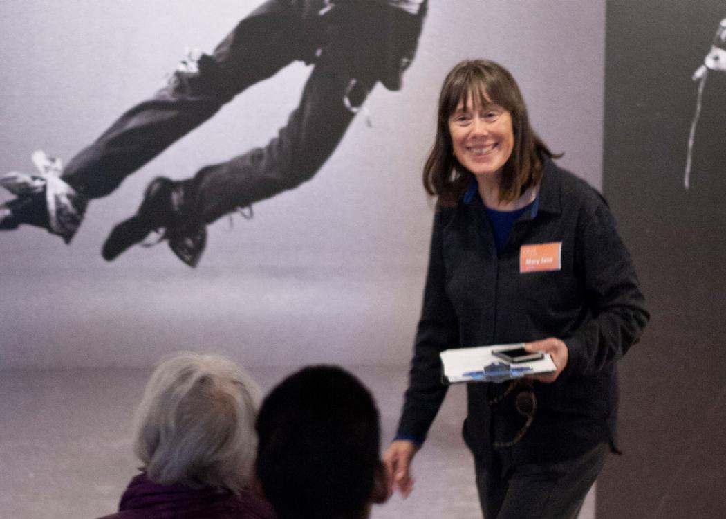 Photo of Mary Jane Knecht leading an artwork discussion