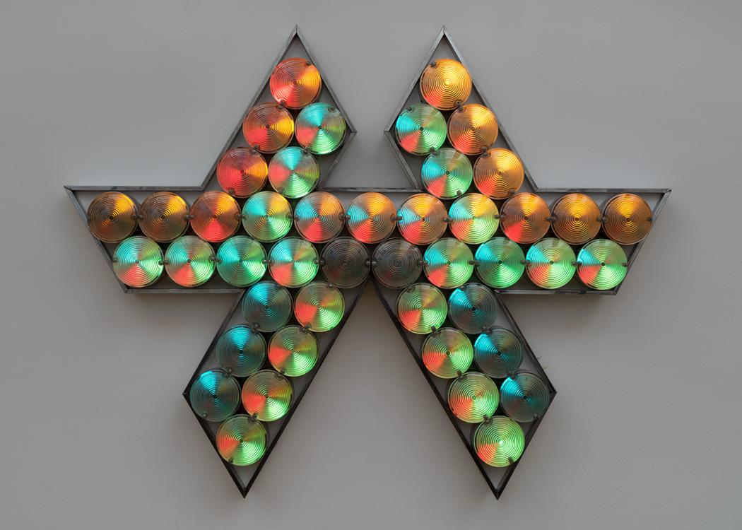 An artwork made up of colorful lightbulbs in a frame