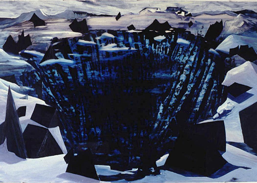 A snowy landscape with a large central crevasse