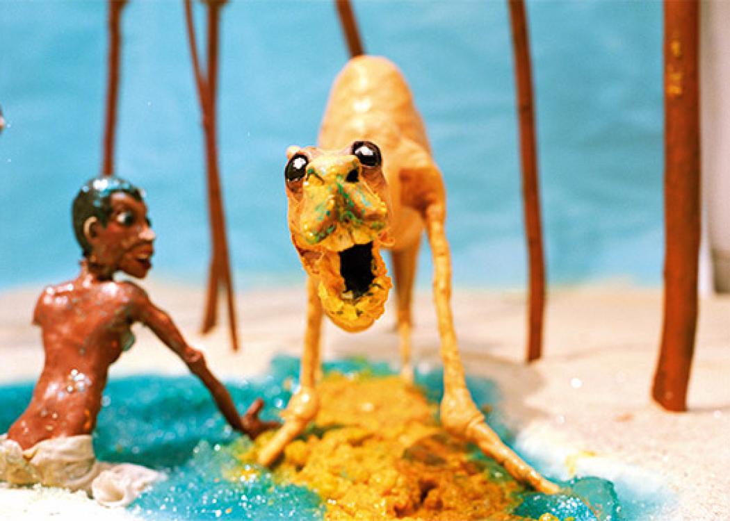 Atills from a stop motion film with a human figure and a dinosaur-esque animal