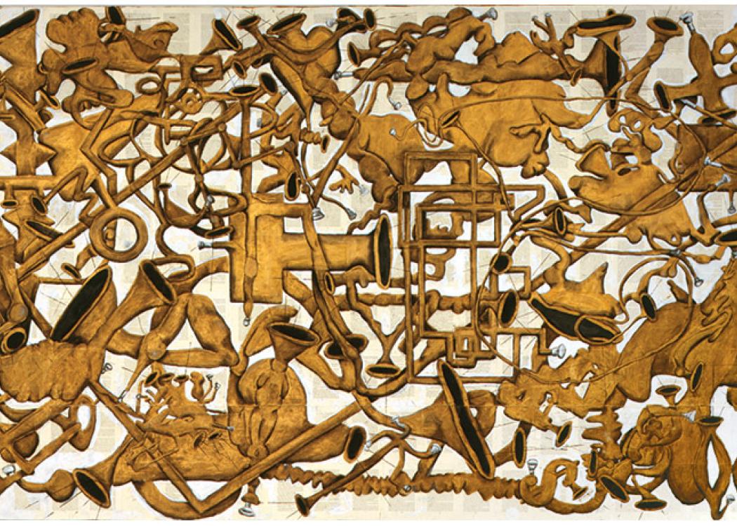 A large artwork with gold-colored, abstract limbs and musical instruments