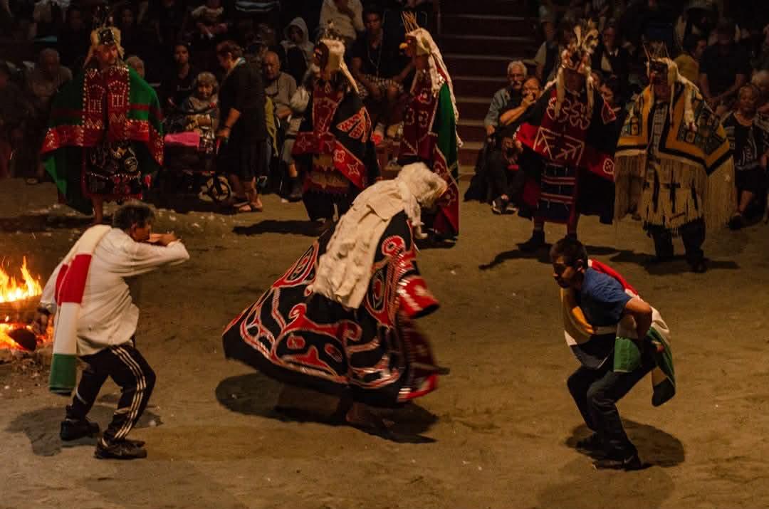 A still from a video of people dancing during a potlatch